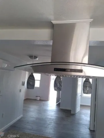 a view of washer and dryer with wooden floor