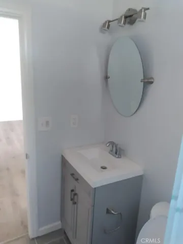 a bathroom with a sink and mirror
