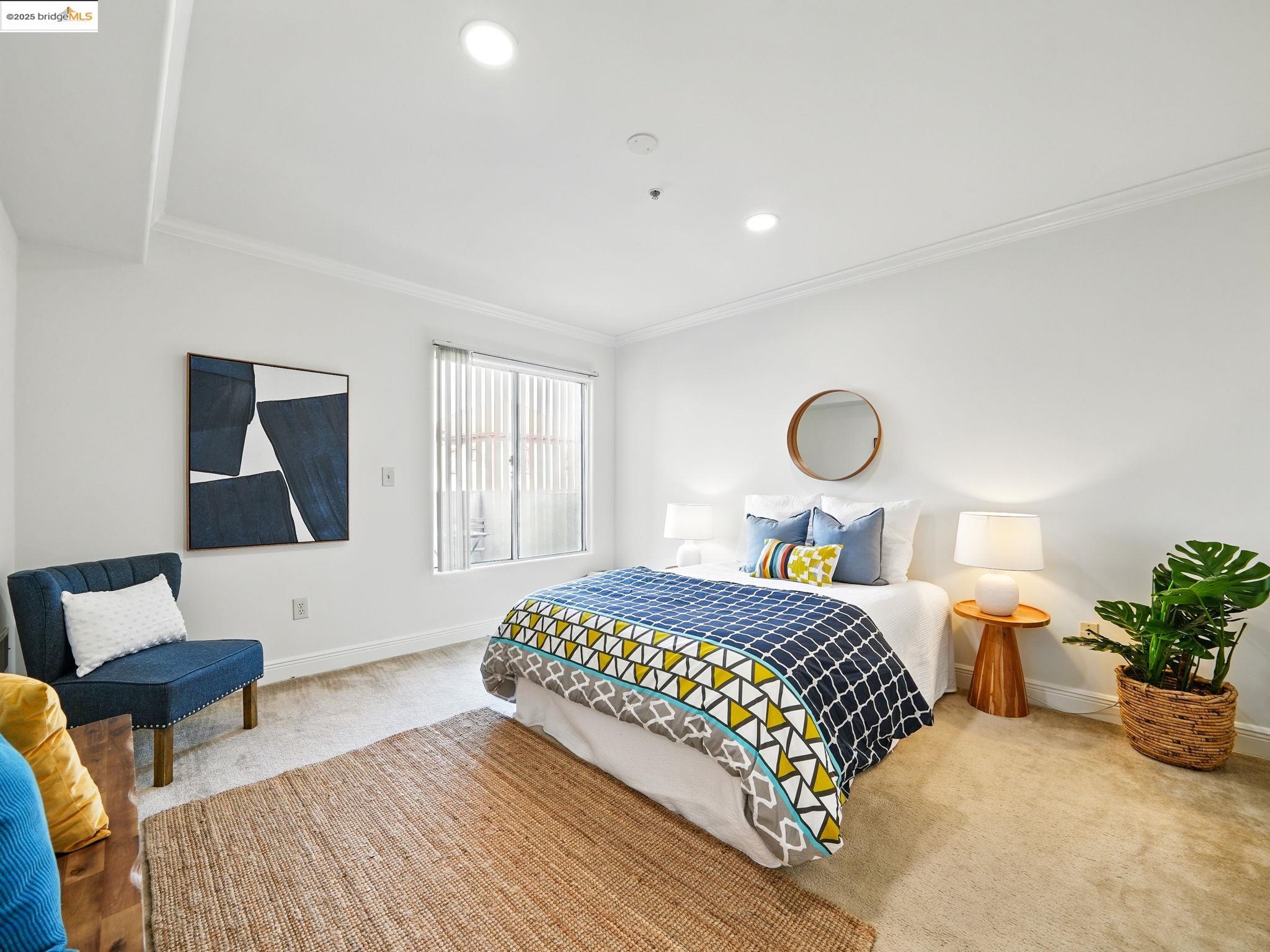 1515 14th Avenue, Unit 201 Oakland, CA 94606 - Photo 12 of 23 a bedroom with a bed and window