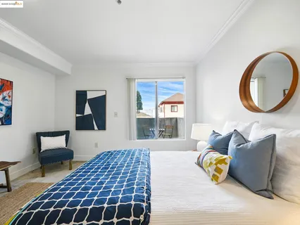 a bedroom with a bed and a couch