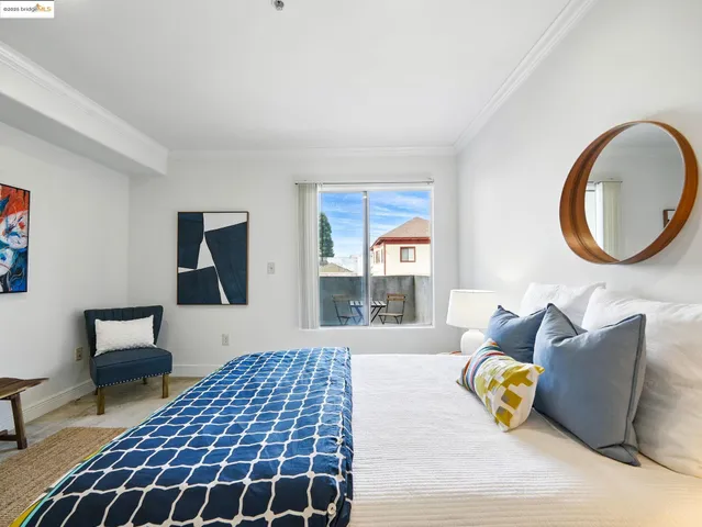 a bedroom with a bed and a couch