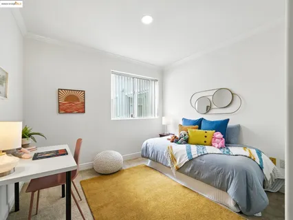 a bedroom with bed and a window