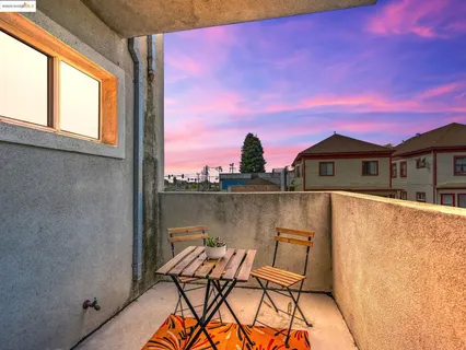 a view of a balcony with chair and table