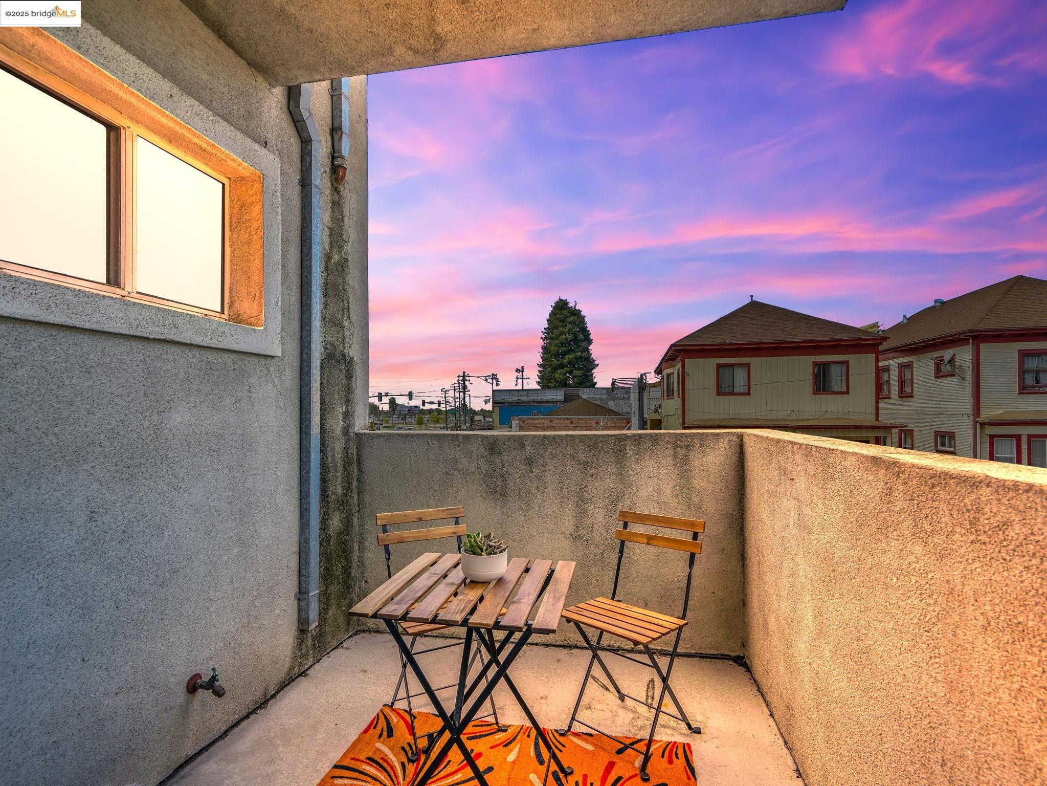 1515 14th Avenue, Unit 201 Oakland, CA 94606 - Photo 18 of 23 a view of a balcony with chair and table
