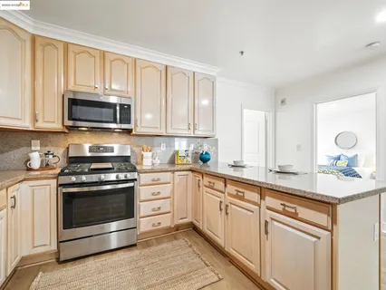 a kitchen with a stove and a microwave