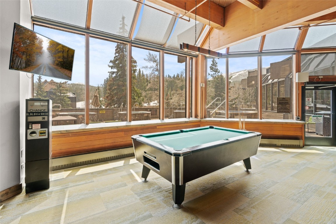 640 Village Road, Unit 4220 Breckenridge, CO 80424 - Photo 20 of 34 Playroom with billiards, plenty of natural light, carpet flooring, and expansive windows