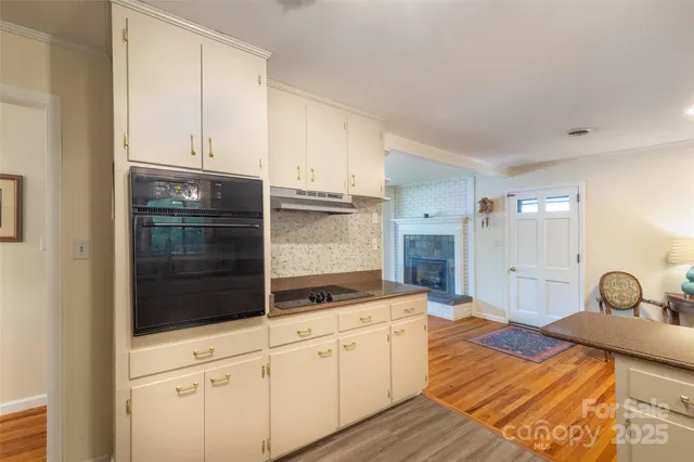 a bedroom with a bed and a view of wooden floor