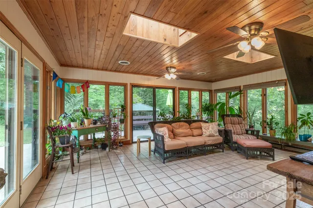 a building outdoor space with patio furniture and potted plants