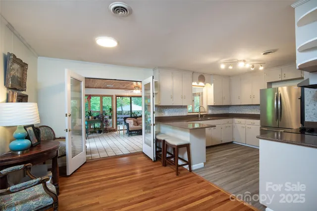 a large kitchen with lots of counter space a sink and appliances