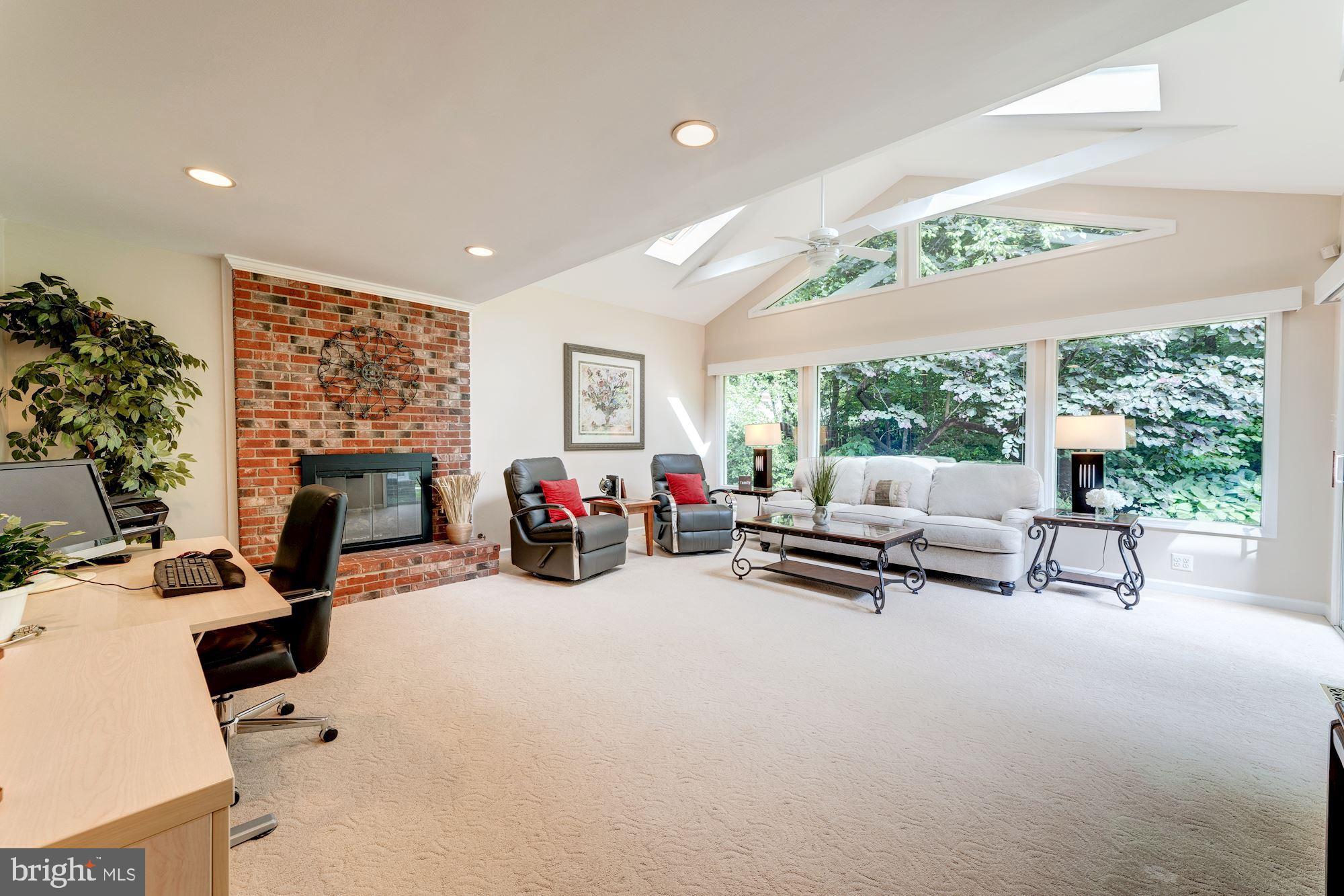 9116 Rockefeller Lane Springfield, VA 22153 - Photo 11 of 56 Expanded family room includes gas fireplace
