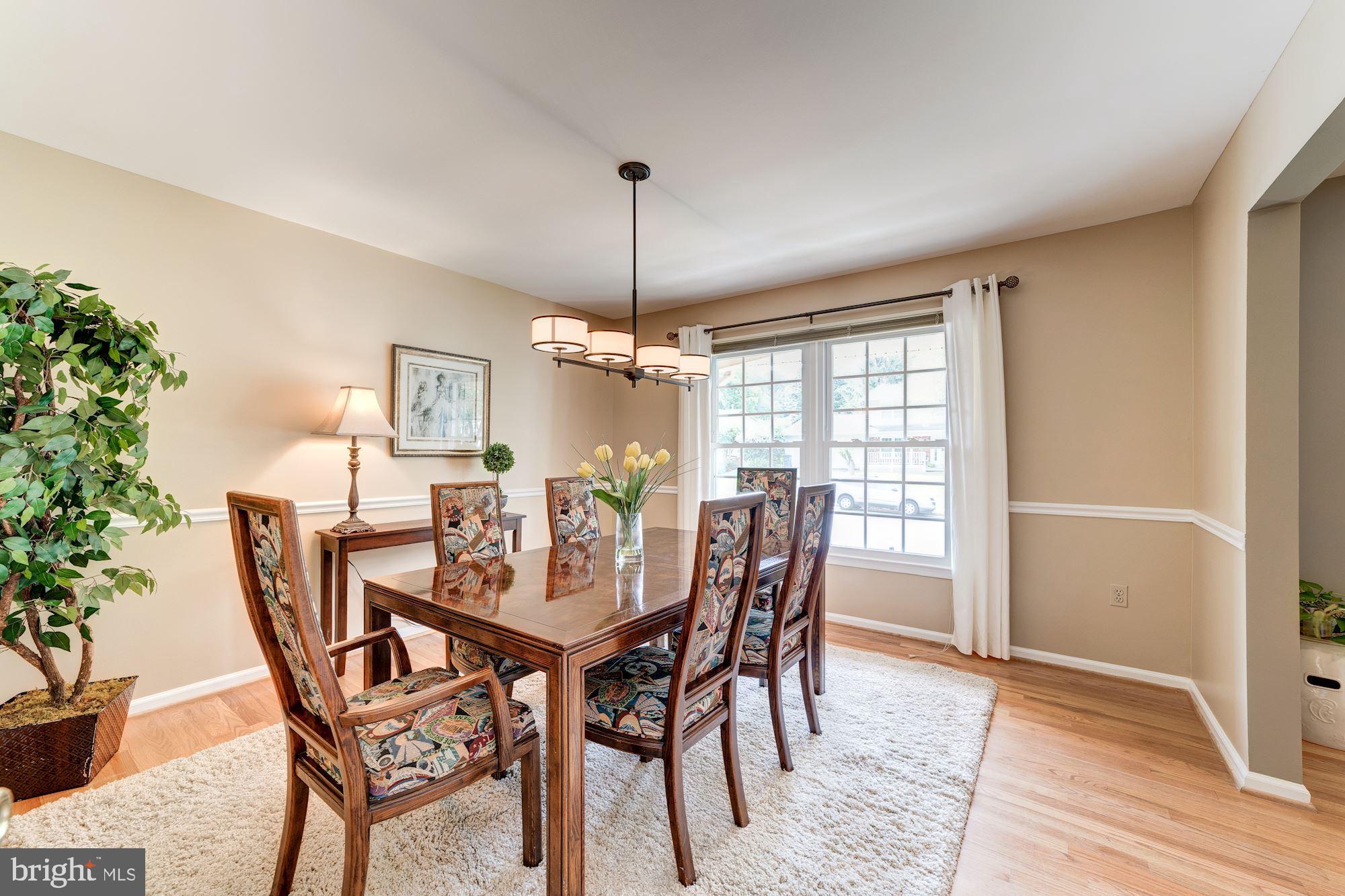 9116 Rockefeller Lane Springfield, VA 22153 - Photo 19 of 56 Formal dining room with hardwood floors