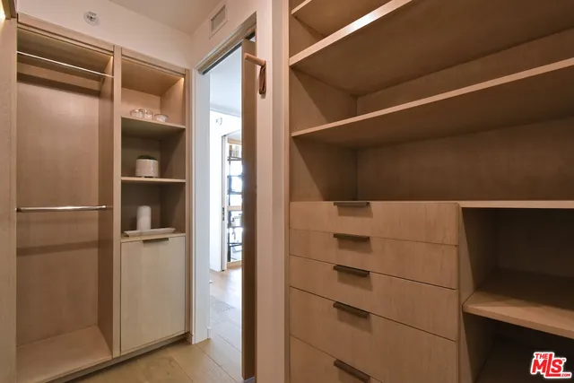 a bedroom with a bed and a walk in closet