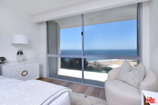 a view of a swimming pool with sitting area