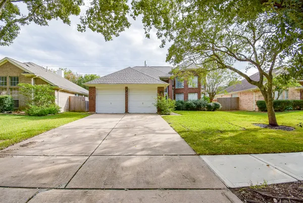 a front view of a house with yard