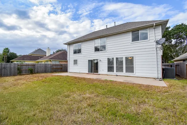 a front view of a house with yard and garage