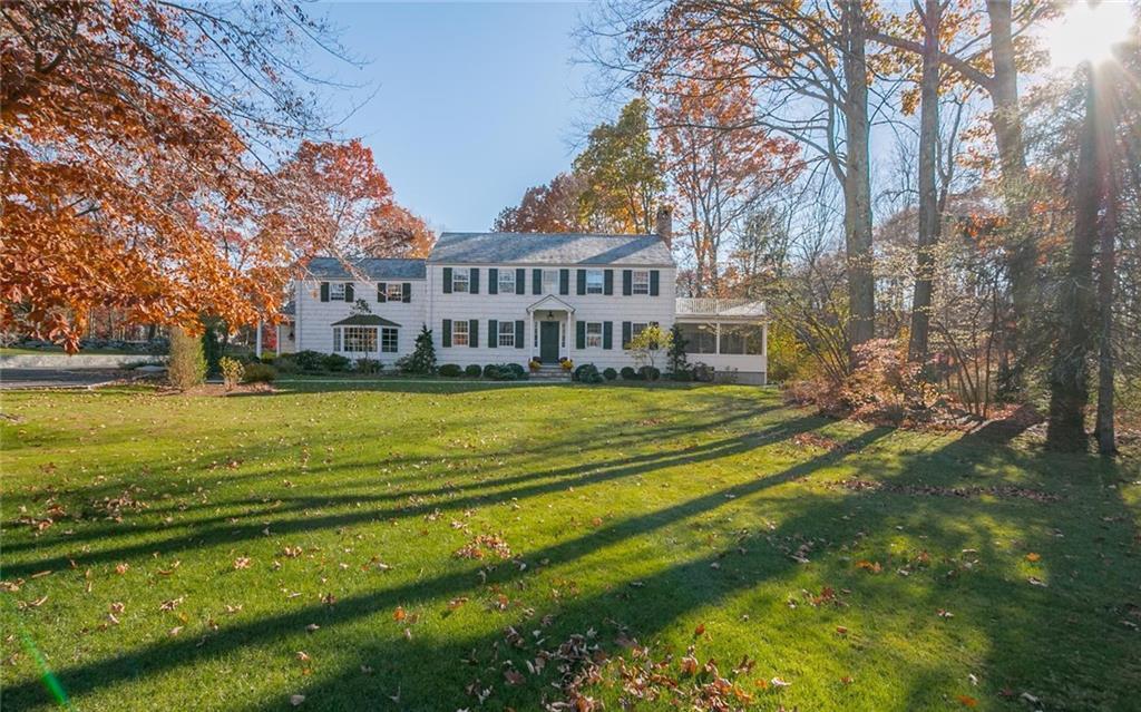 145 Millstone Road Wilton, CT 06897 - Photo 1 of 1 a view of a house with a big yard and large trees