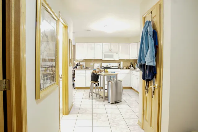 a kitchen with a refrigerator and a sink
