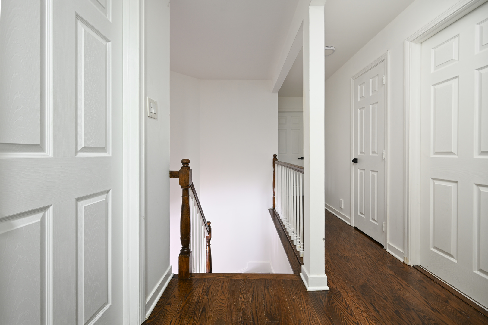 360 Erie Circle Bloomingdale, IL 60108 - Photo 15 of 30 a view of a hallway with wooden floor and staircase
