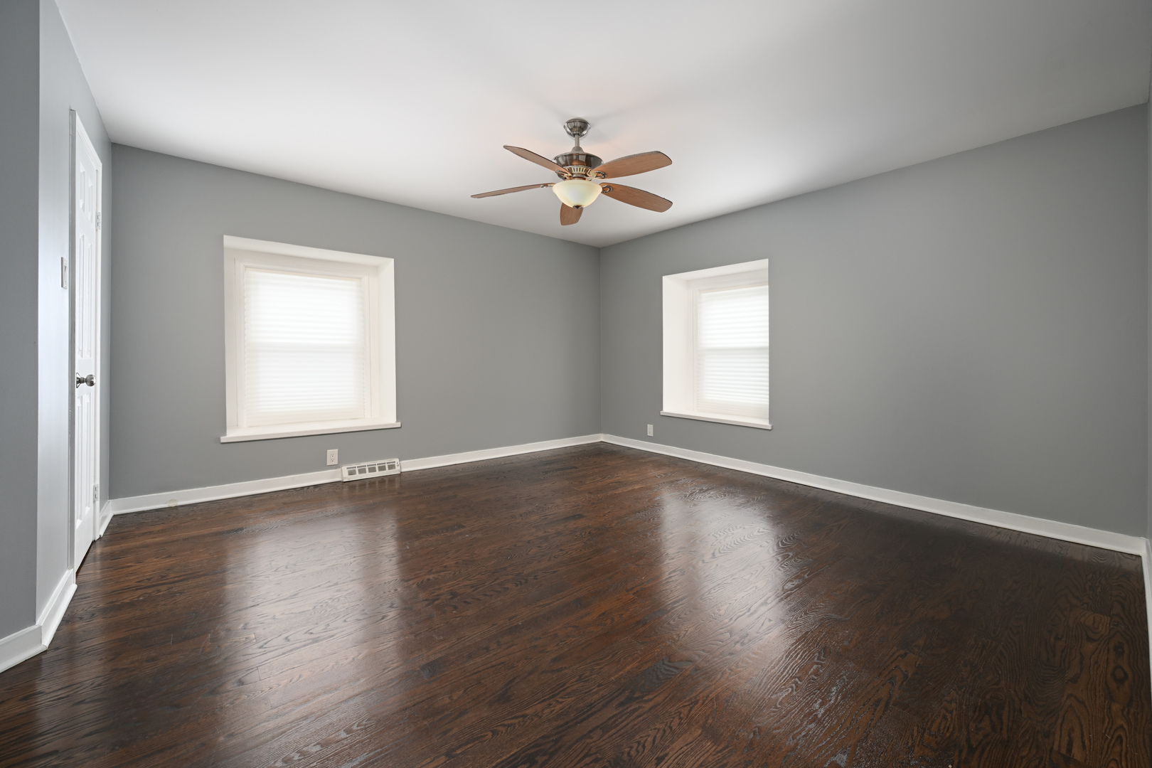 360 Erie Circle Bloomingdale, IL 60108 - Photo 16 of 30 a view of empty room with wooden floor and fan