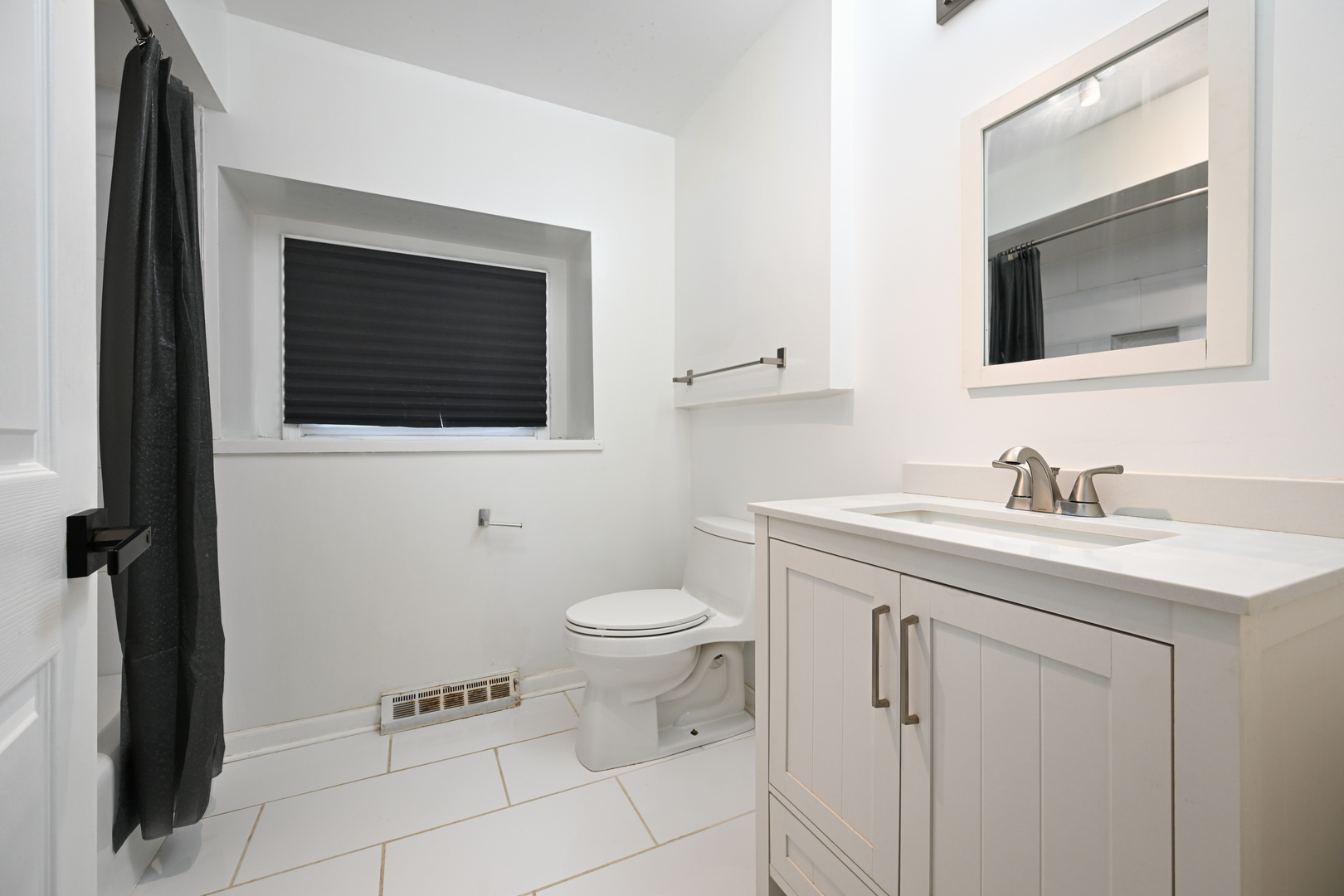 360 Erie Circle Bloomingdale, IL 60108 - Photo 20 of 30 a bathroom with a toilet sink and mirror