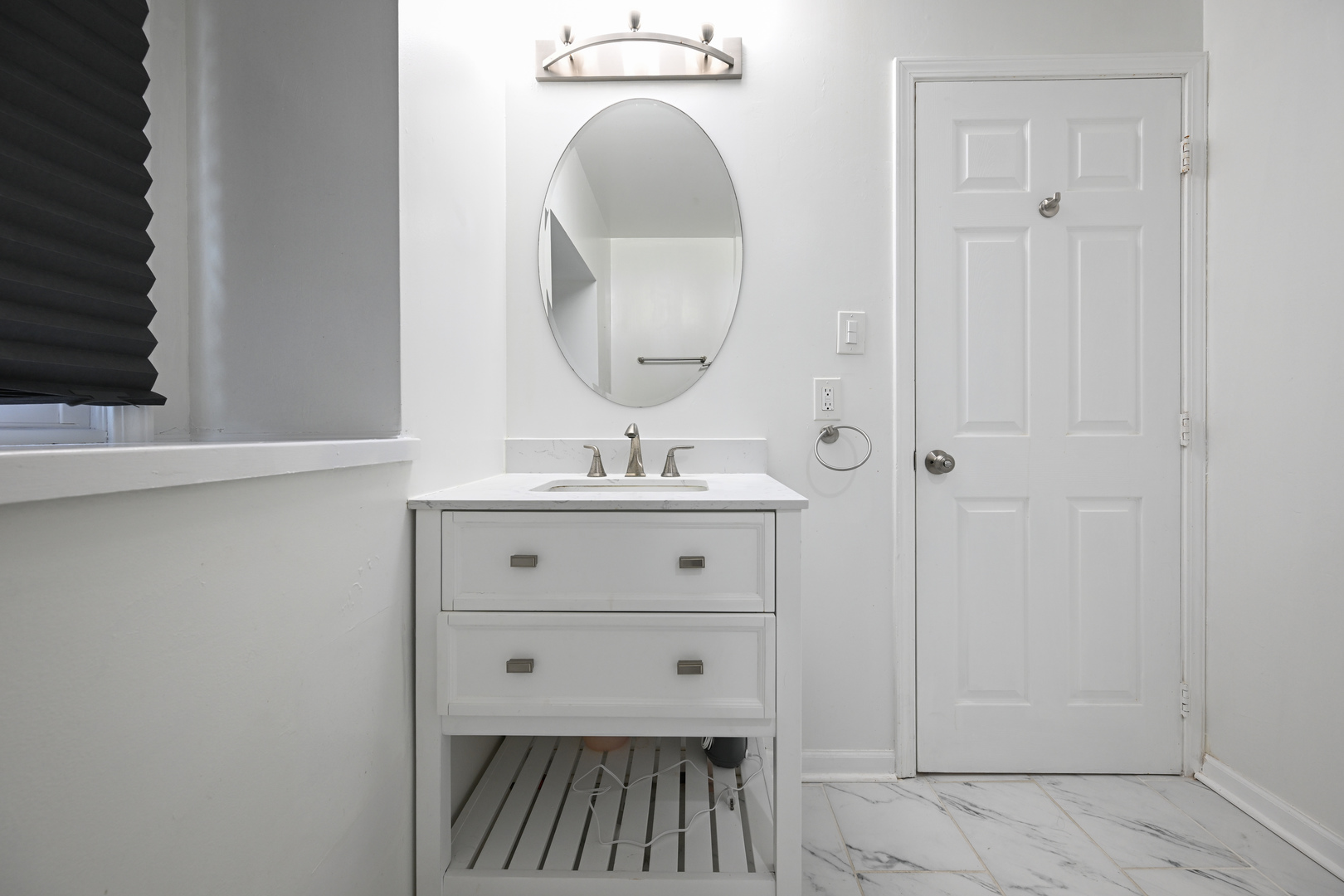 360 Erie Circle Bloomingdale, IL 60108 - Photo 25 of 30 a bathroom with a sink mirror and vanity