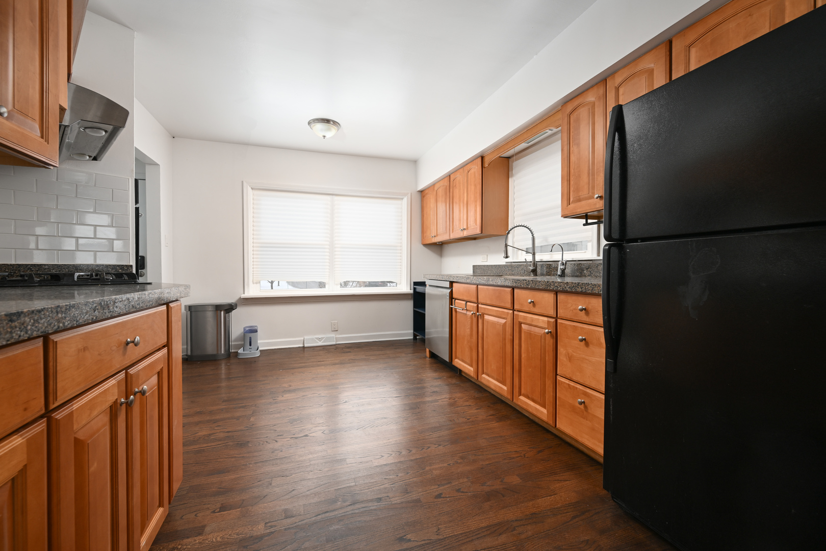 360 Erie Circle Bloomingdale, IL 60108 - Photo 7 of 30 a kitchen with stainless steel appliances granite countertop a stove a sink dishwasher and a refrigerator