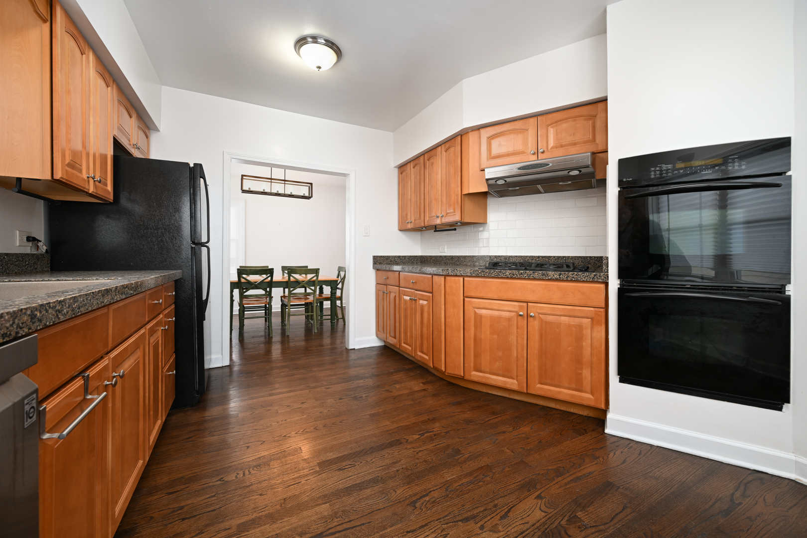 360 Erie Circle Bloomingdale, IL 60108 - Photo 8 of 30 a kitchen with stainless steel appliances granite countertop a refrigerator stove and sink