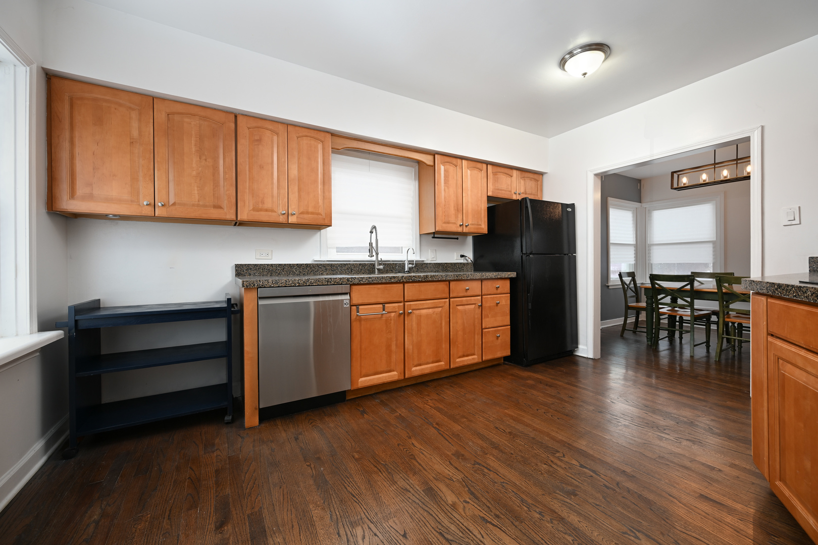 360 Erie Circle Bloomingdale, IL 60108 - Photo 9 of 30 a kitchen with stainless steel appliances granite countertop a refrigerator a sink dishwasher a stove and a microwave oven with wooden floor