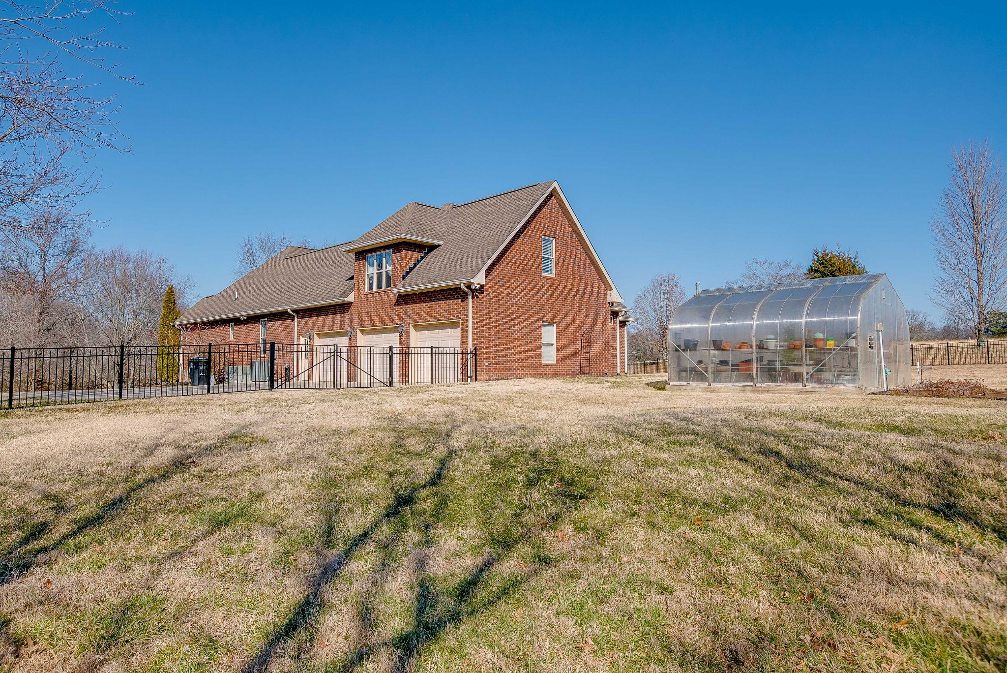 513 Lee Road Cottontown, TN 37048 - Photo 49 of 55 a front view of a house with garden