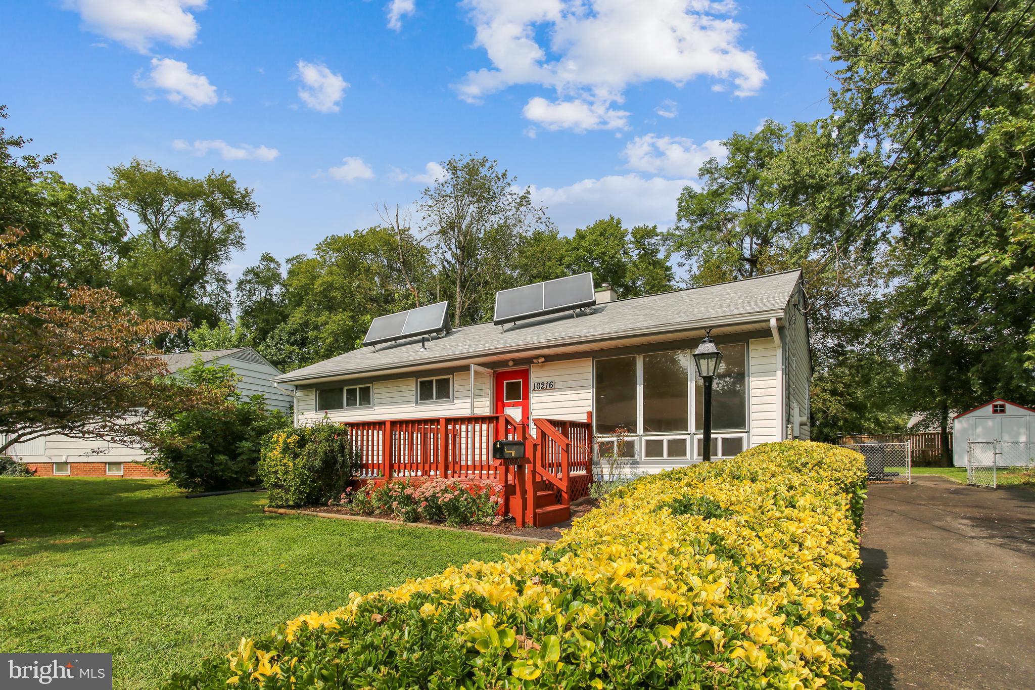 10216 Rodgers Road Fairfax, VA 22030 - Photo 4 of 20 a view of a house with a yard patio and fire pit