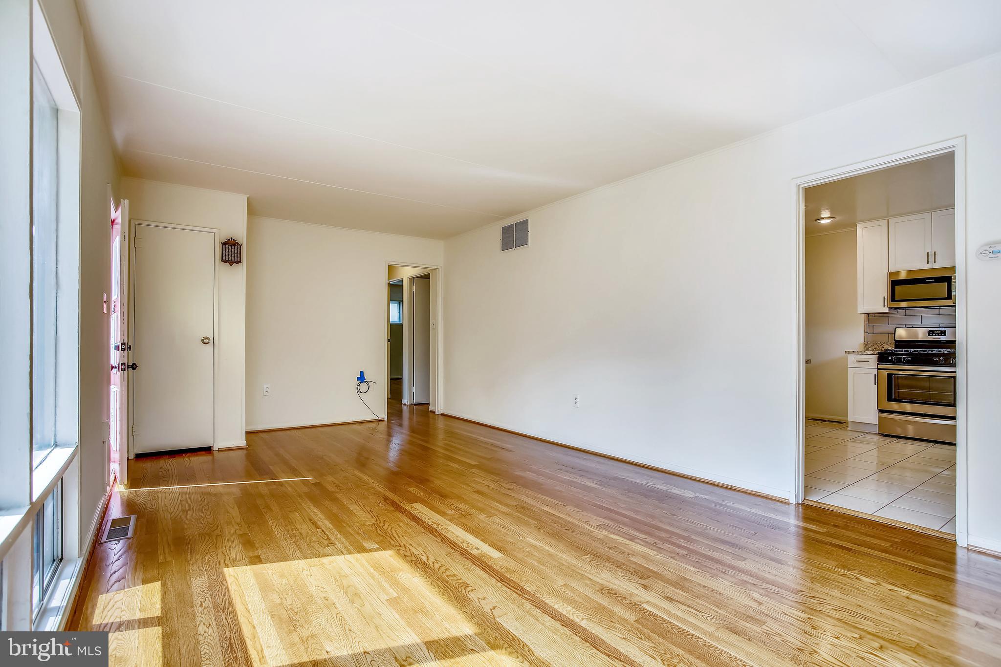 10216 Rodgers Road Fairfax, VA 22030 - Photo 7 of 20 a view of empty room with wooden floor