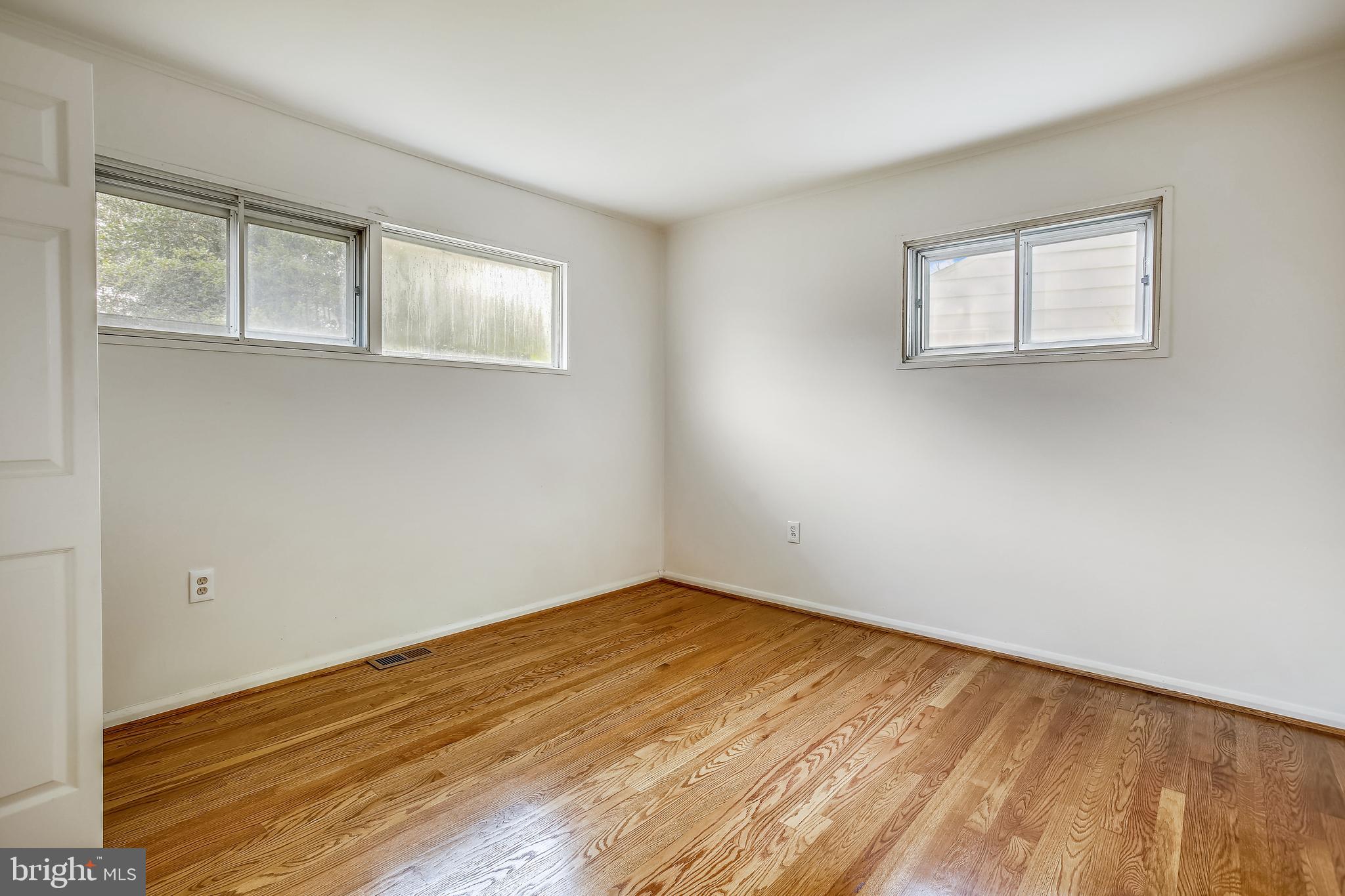 10216 Rodgers Road Fairfax, VA 22030 - Photo 8 of 20 a view of empty room with wooden floor and fan