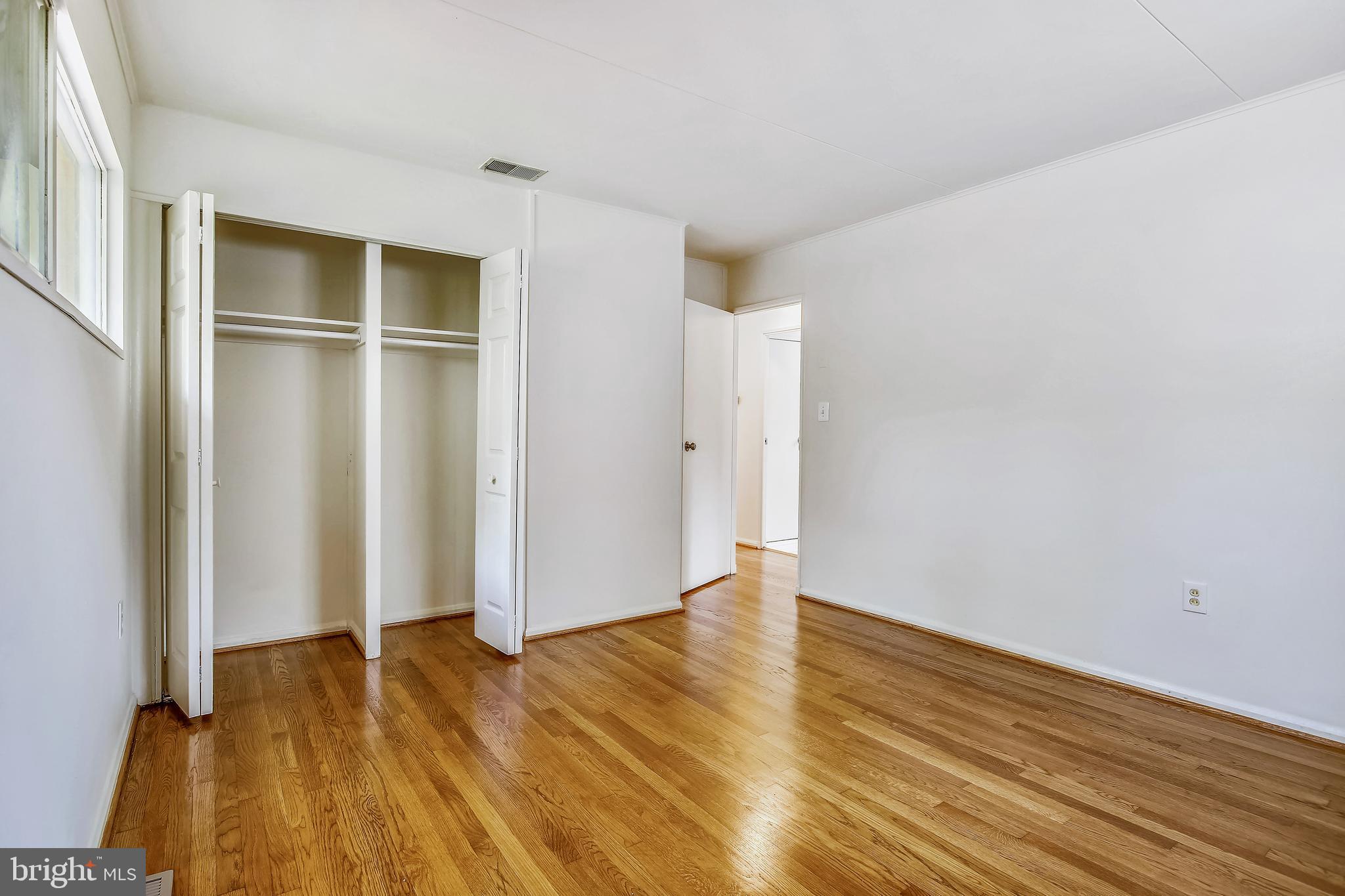 10216 Rodgers Road Fairfax, VA 22030 - Photo 10 of 20 wooden floor in an empty room