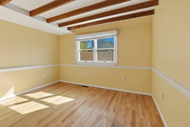 a view of an empty room with a windows