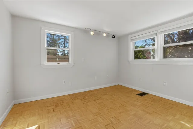 a view of a kitchen with wooden floor and a kitchen