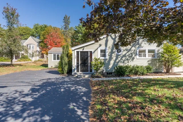 a kitchen with stainless steel appliances granite countertop a stove a sink and white cabinets