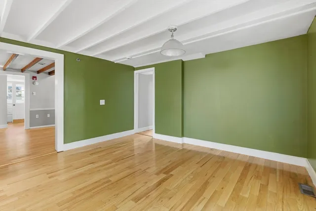 a backyard of a house with barbeque oven table and chairs