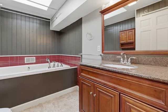 a bathroom with a bathtub and a shower