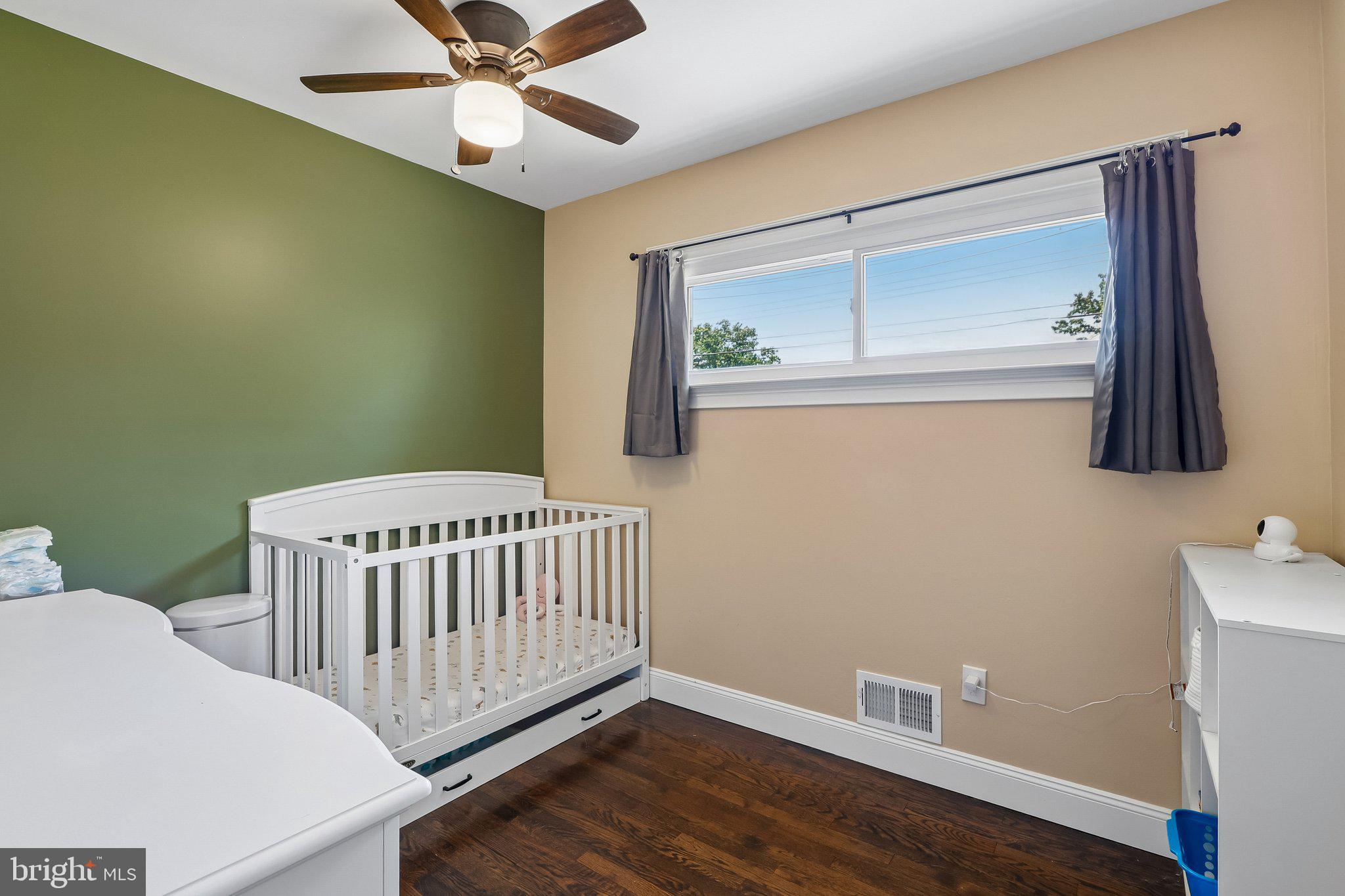 73 Burnt Tavern Road Brick, NJ 08724 - Photo 19 of 31 a bedroom with a bed and wooden floor
