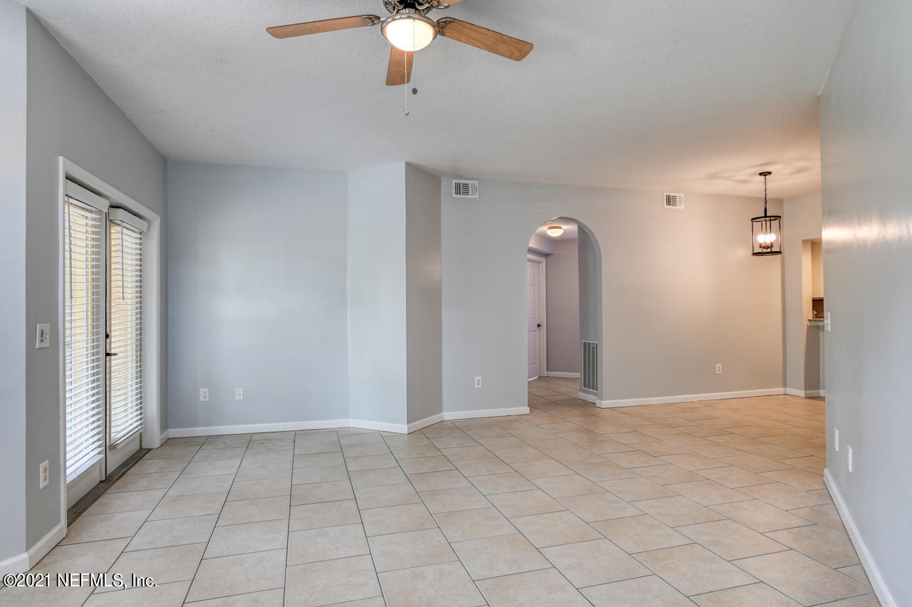 3400 Haley Pointe Road St. Augustine, FL 32084 - Photo 14 of 41 a view of a livingroom with a chandelier fan and windows