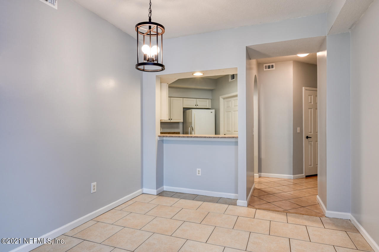 3400 Haley Pointe Road St. Augustine, FL 32084 - Photo 7 of 41 a view of a hallway view with wooden floor and staircase