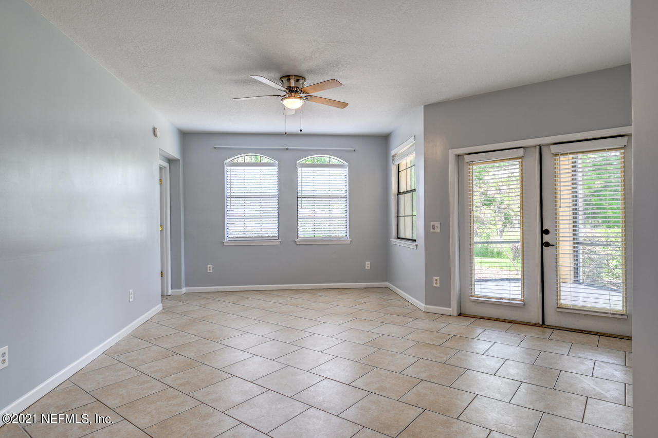 3400 Haley Pointe Road St. Augustine, FL 32084 - Photo 9 of 41 a view of an empty room with window and chandelier fan
