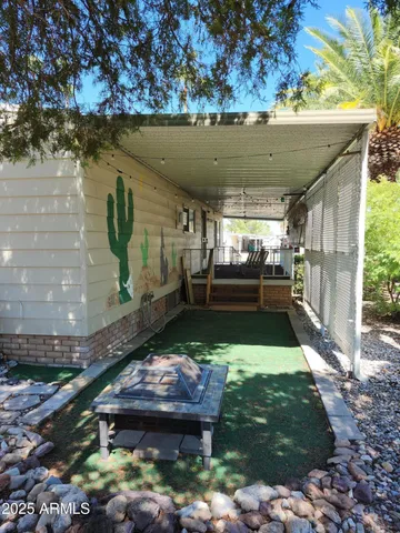 a view of a yard with cars parked