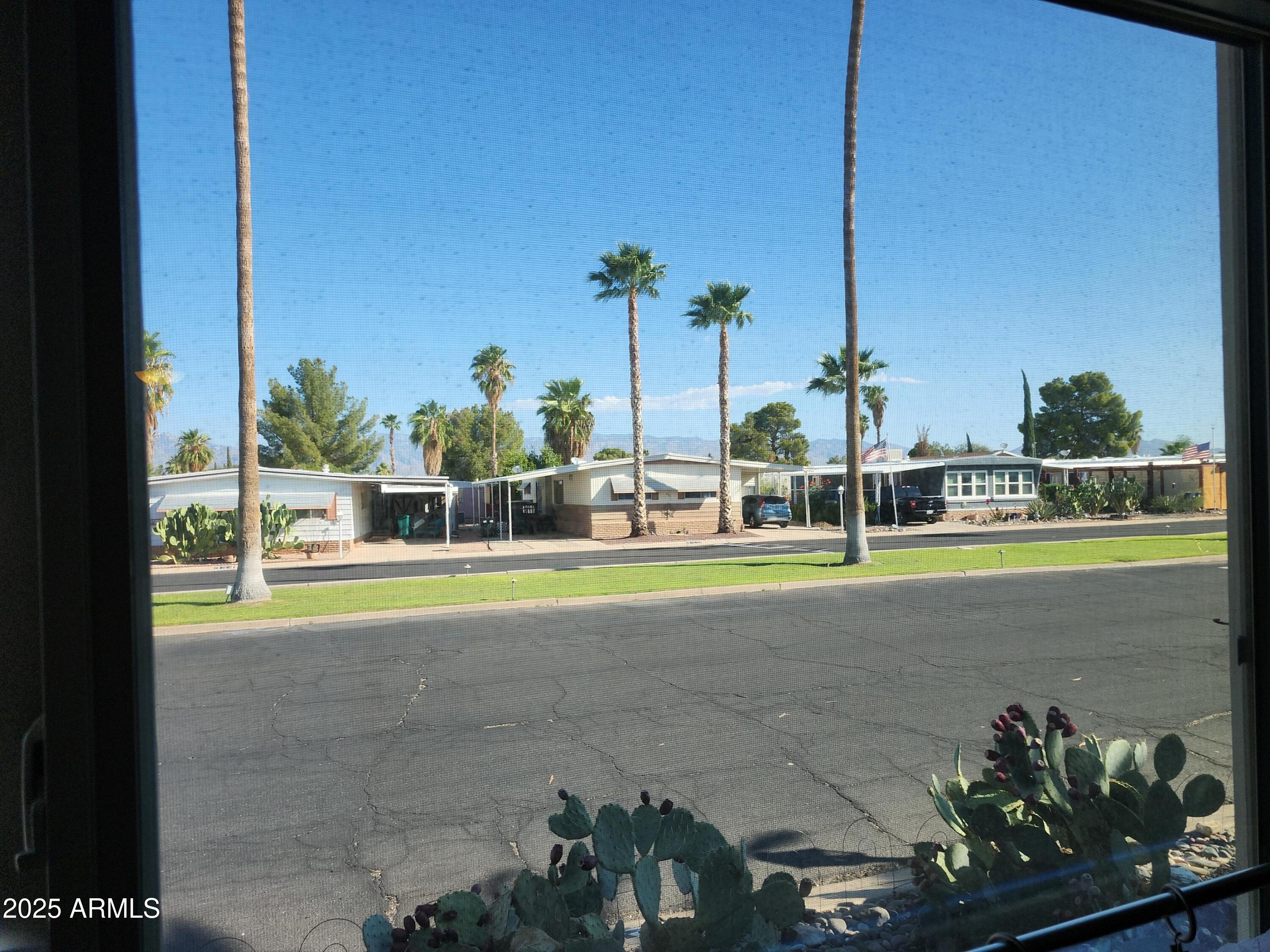 3411 South Camino Seco, Unit 213 Tucson, AZ 85730 - Photo 18 of 22 a view of a garden with a slide