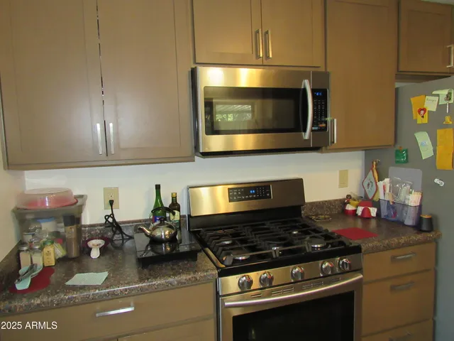 a kitchen with a stove and a microwave