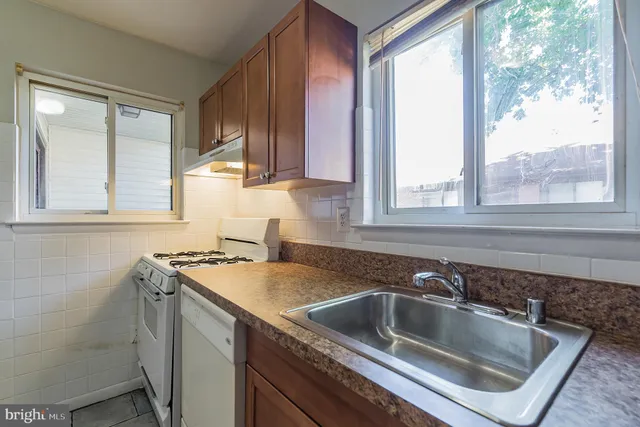 a kitchen that has a sink and a window