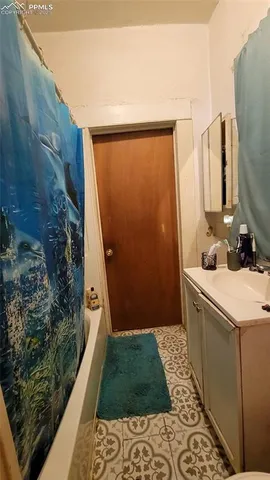 a bathroom with a sink and mirror