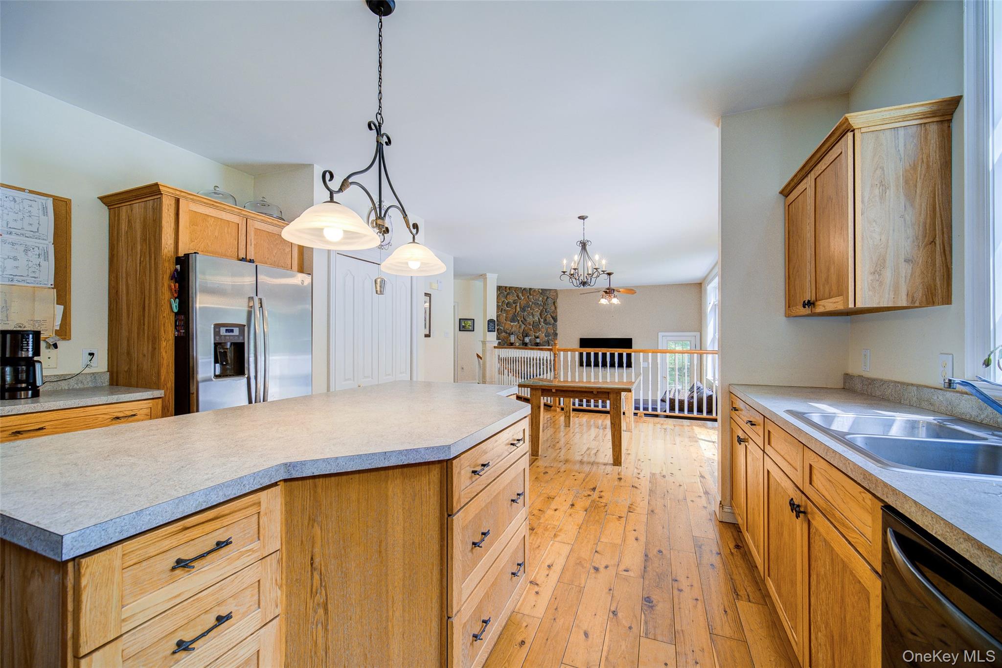221 Rabbit Run Road Clintondale, NY 12515 - Photo 12 of 50 a kitchen with stainless steel appliances granite countertop a sink a stove and a wooden floors