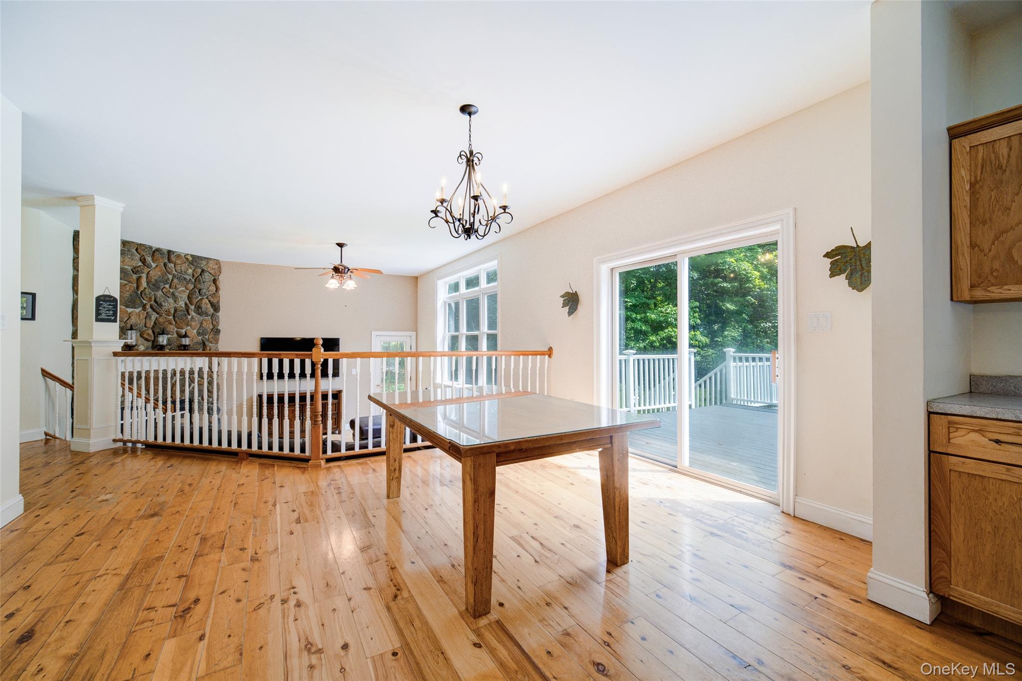 221 Rabbit Run Road Clintondale, NY 12515 - Photo 14 of 50 a view of a room with wooden floor windows and a chandelier