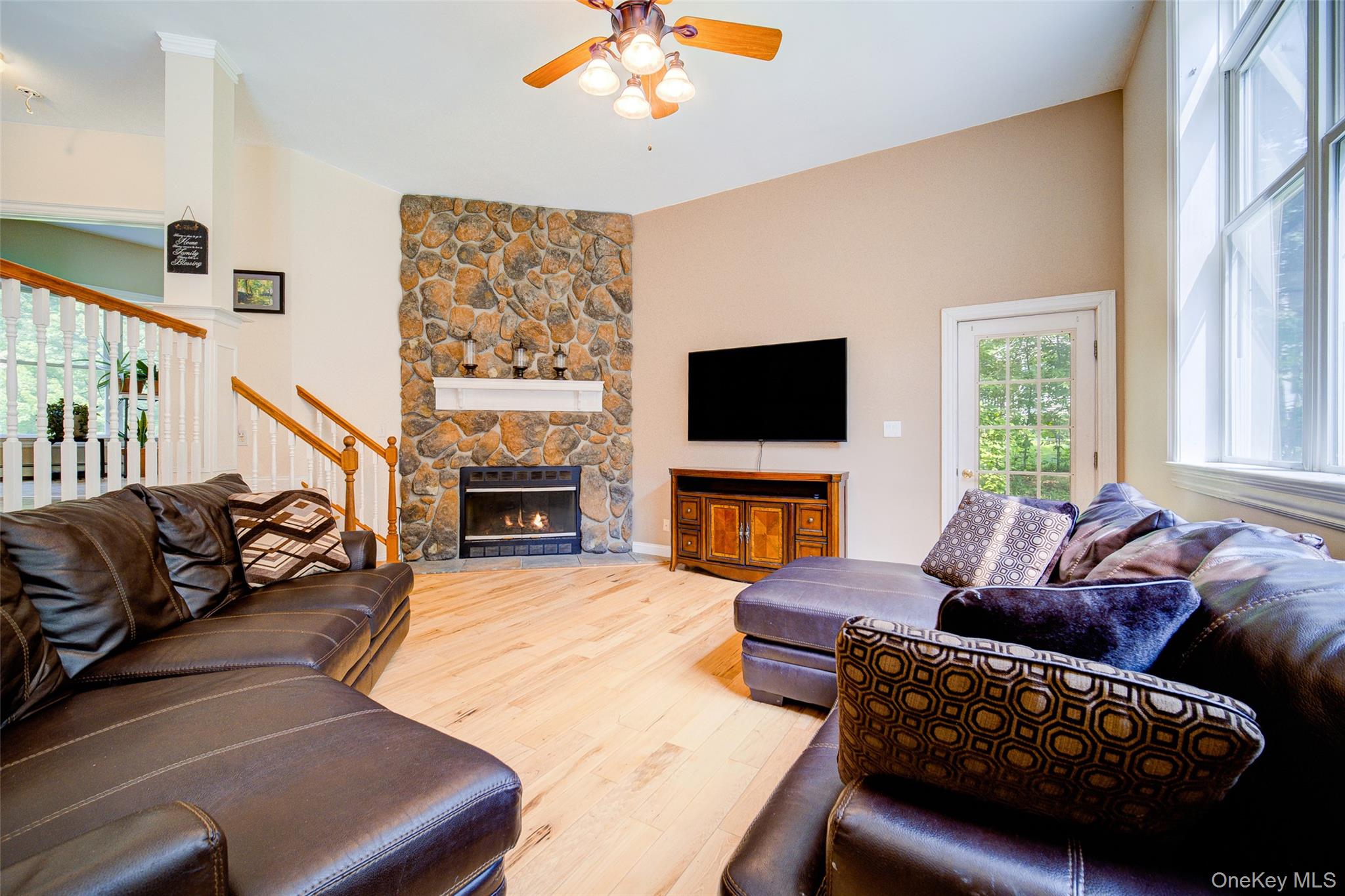 221 Rabbit Run Road Clintondale, NY 12515 - Photo 15 of 50 a living room with furniture a fireplace and a flat screen tv